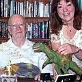 Sir Arthur in his library, with Heather Couper and friend.